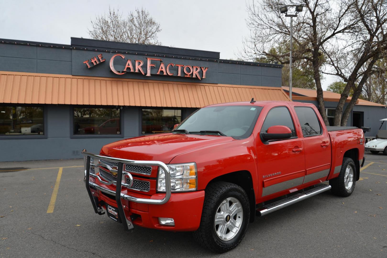 2012 Red /Gray leather Chevrolet Silverado 1500 LTZ Crew Cab 4WD (3GCPKTE70CG) with an 5.3L V8 OHV 16V FFV engine, 6-Speed Automatic transmission, located at 4562 State Avenue, Billings, MT, 59101, (406) 896-9833, 45.769516, -108.526772 - 2012 Chevrolet Silverado 1500 LTZ Crew Cab 4WD - Very clean! 5.3L V8 OHV 16V FFV Engine - 6-Speed Automatic Transmission - Z71 - 4WD - 155,529 miles LTZ Plus package - dual zone climate control - tilt wheel - cruise control - Bose audio with steering wheel controls - power windows and door loc - Photo#1