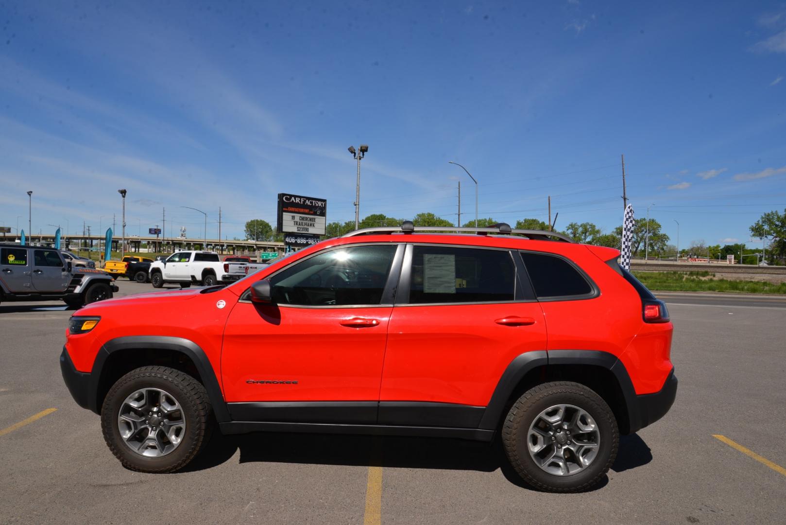 2019 Firecracker Red /Black Leather Jeep Cherokee Trailhawk (1C4PJMBXXKD) with an 3.2L V6 engine, 9 speed automatic transmission, located at 4562 State Avenue, Billings, MT, 59101, (406) 896-9833, 45.769516, -108.526772 - 2019 Jeep Cherokee Trail Hawk 4x4 The Trail Hawk is a Low Mileage Local trade in, it is a 1 Owner jeep. The interior and exterior are in very clean condition and the suv runs and drives nicely. The Tires are 17 Inch Open Range All Terrain's and they are in good condition. it has a 3.2 Liter V6, 9 - Photo#3