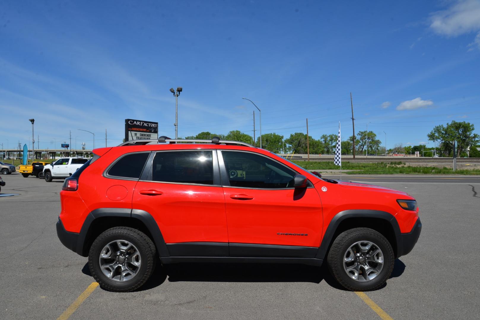 2019 Firecracker Red /Black Leather Jeep Cherokee Trailhawk (1C4PJMBXXKD) with an 3.2L V6 engine, 9 speed automatic transmission, located at 4562 State Avenue, Billings, MT, 59101, (406) 896-9833, 45.769516, -108.526772 - 2019 Jeep Cherokee Trail Hawk 4x4 The Trail Hawk is a Low Mileage Local trade in, it is a 1 Owner jeep. The interior and exterior are in very clean condition and the suv runs and drives nicely. The Tires are 17 Inch Open Range All Terrain's and they are in good condition. it has a 3.2 Liter V6, 9 - Photo#4