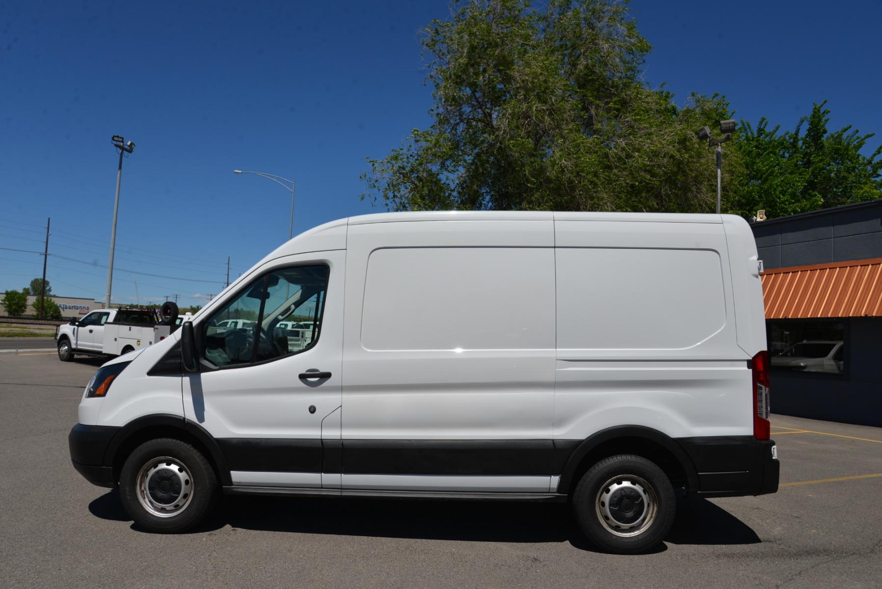2019 White /Gray Ford Transit Cargo Van (1FTYE1CM2KK) with an 3.7 engine, 6 speed automatic transmission, located at 4562 State Avenue, Billings, MT, 59101, (406) 896-9833, 45.769516, -108.526772 - 2019 Ford Transit 150 Van Med. Roof w/Sliding Pass. 130-in. WB - One owner! 3.7 TIVCT V6 engine - 6 speed automatic select shift transmission - rear wheel drive - 93,307 miles - Inspected and serviced - copy of inspection and work performed as well as a complete vehicle history report provided - Photo #1