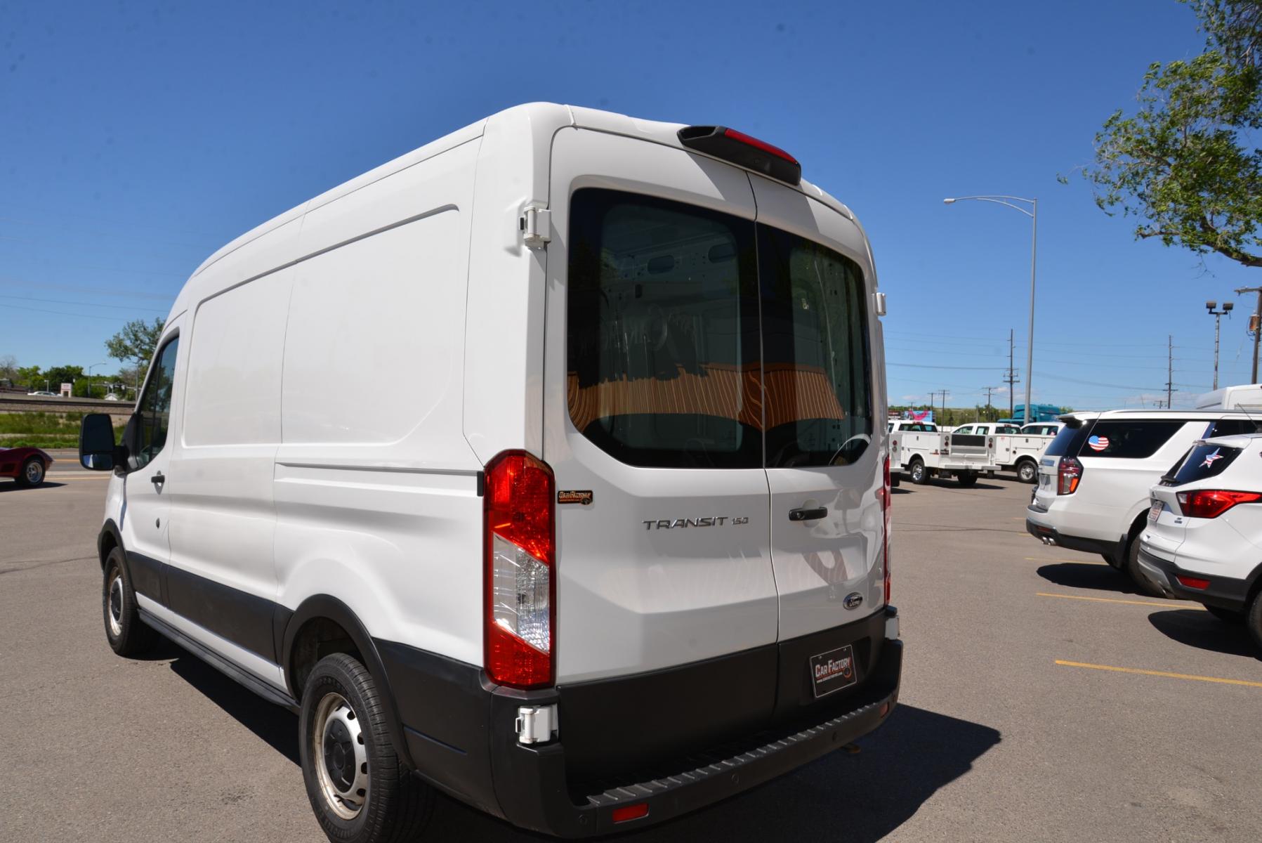2019 White /Gray Ford Transit Cargo Van (1FTYE1CM2KK) with an 3.7 engine, 6 speed automatic transmission, located at 4562 State Avenue, Billings, MT, 59101, (406) 896-9833, 45.769516, -108.526772 - 2019 Ford Transit 150 Van Med. Roof w/Sliding Pass. 130-in. WB - One owner! 3.7 TIVCT V6 engine - 6 speed automatic select shift transmission - rear wheel drive - 93,307 miles - Inspected and serviced - copy of inspection and work performed as well as a complete vehicle history report provided - Photo #3