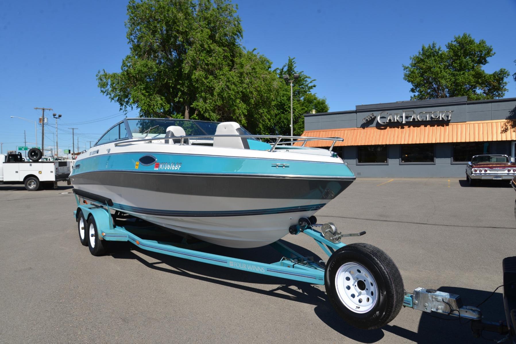 1990 Blue Four Winns Sun Downer (4WNMK149H99) with an 350 Chevy V8 engine, located at 4562 State Avenue, Billings, MT, 59101, (406) 896-9833, 45.769516, -108.526772 - 1990 Four Winns Sundowner 21 Foot Boat with trailer Seats 10 5.7L Chevy V8 OMC Outdrive External Exhaust with tip downs Upholstery was recently redone with 2 captains chairs Boat has had a bow conversion to make it like a runabout 4 swivel type fishing Chairs Tandem Axle Trailer with surge - Photo #13