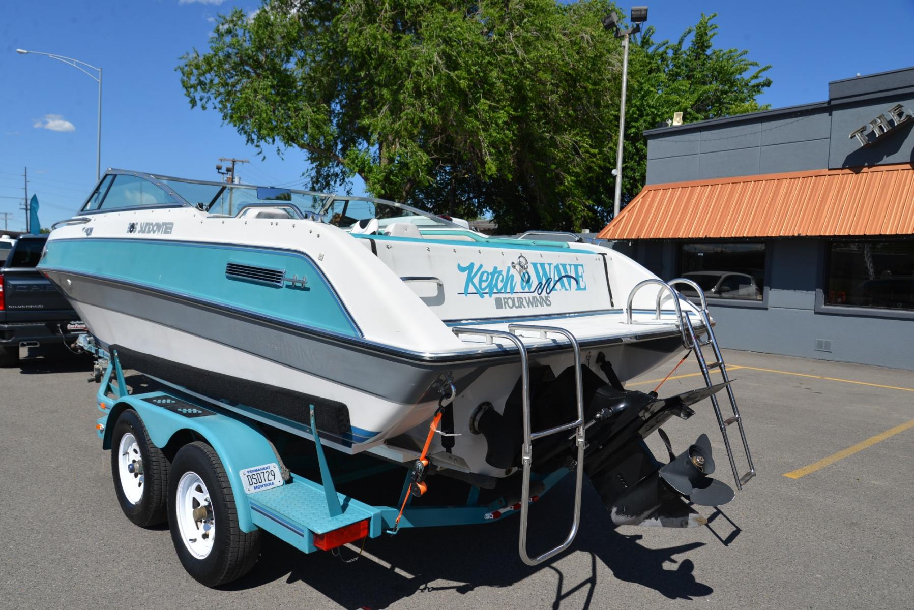 1990 Blue Four Winns Sun Downer (4WNMK149H99) with an 350 Chevy V8 engine, located at 4562 State Avenue, Billings, MT, 59101, (406) 896-9833, 45.769516, -108.526772 - 1990 Four Winns Sundowner 21 Foot Boat with trailer Seats 10 5.7L Chevy V8 OMC Outdrive External Exhaust with tip downs Upholstery was recently redone with 2 captains chairs Boat has had a bow conversion to make it like a runabout 4 swivel type fishing Chairs Tandem Axle Trailer with surge - Photo #3