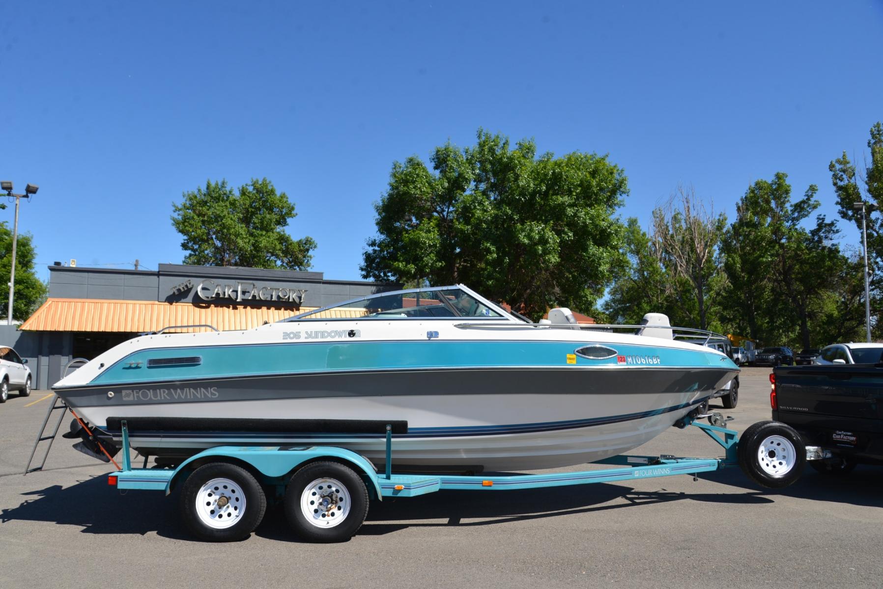 1990 Blue Four Winns Sun Downer (4WNMK149H99) with an 350 Chevy V8 engine, located at 4562 State Avenue, Billings, MT, 59101, (406) 896-9833, 45.769516, -108.526772 - 1990 Four Winns Sundowner 21 Foot Boat with trailer Seats 10 5.7L Chevy V8 OMC Outdrive External Exhaust with tip downs Upholstery was recently redone with 2 captains chairs Boat has had a bow conversion to make it like a runabout 4 swivel type fishing Chairs Tandem Axle Trailer with surge - Photo #12