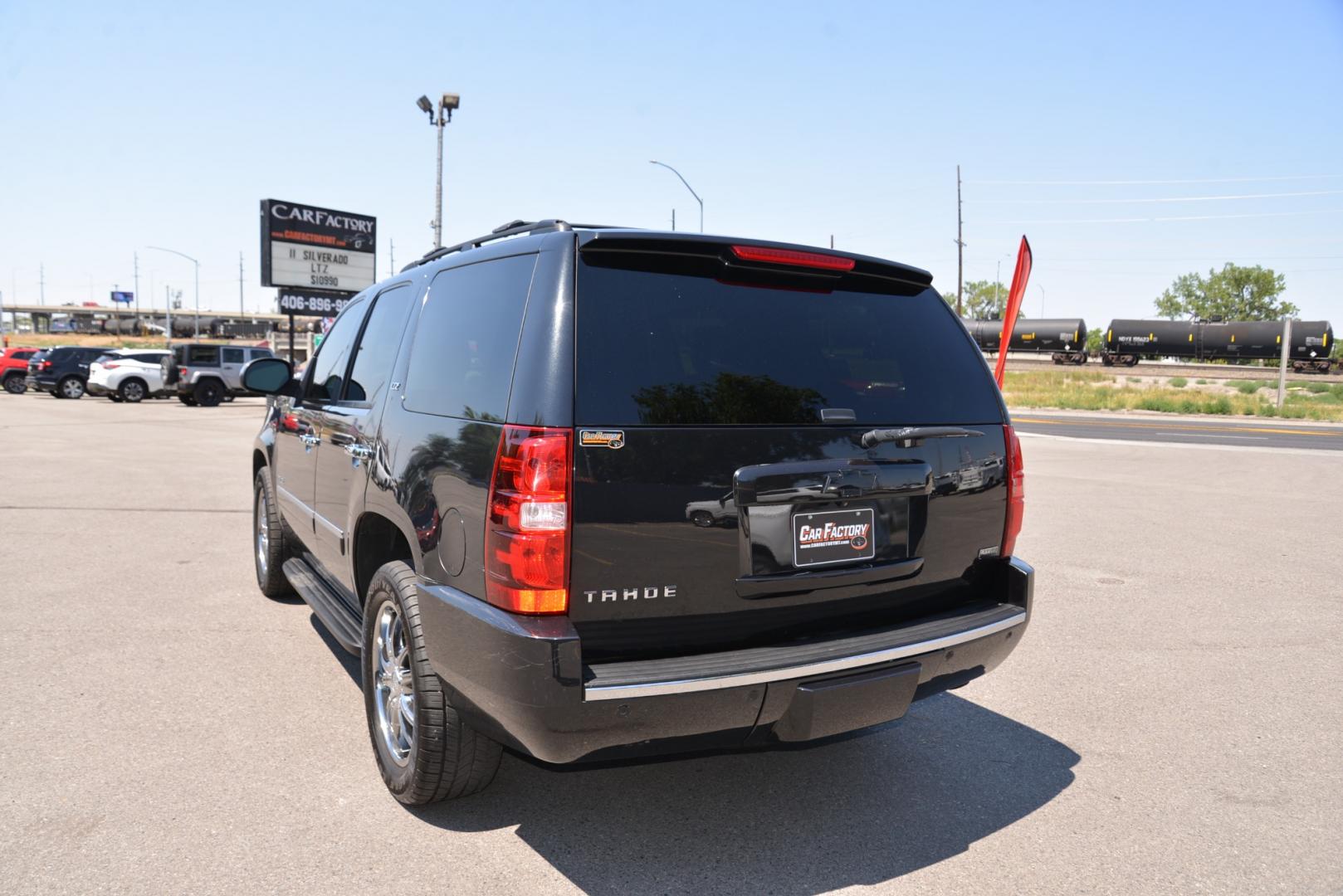 2011 Black Granite Metallic /Light Titanium/Dark Titanium Chevrolet Tahoe LTZ (1GNSKCE03BR) with an 5.3L V8 engine, 6 speed automatic transmission, located at 4562 State Avenue, Billings, MT, 59101, (406) 896-9833, 45.769516, -108.526772 - 2011 Chevy Tahoe 4 Wheel Drive, with a 5.3 Liter V8, 6 Speed automatic transmission,  3.42 ratio Rear Axle, 7300 pound GVWR , Heavy duty locking rear differential and Heavy duty Trailering package Features include LTZ package Sun, Entertainment and destinations package 2nd row captains chairs a - Photo#7