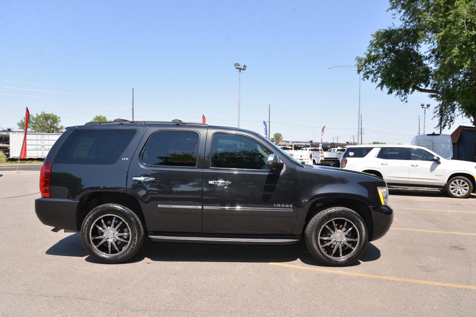 2011 Black Granite Metallic /Light Titanium/Dark Titanium Chevrolet Tahoe LTZ (1GNSKCE03BR) with an 5.3L V8 engine, 6 speed automatic transmission, located at 4562 State Avenue, Billings, MT, 59101, (406) 896-9833, 45.769516, -108.526772 - 2011 Chevy Tahoe 4 Wheel Drive, with a 5.3 Liter V8, 6 Speed automatic transmission,  3.42 ratio Rear Axle, 7300 pound GVWR , Heavy duty locking rear differential and Heavy duty Trailering package Features include LTZ package Sun, Entertainment and destinations package 2nd row captains chairs a - Photo#1