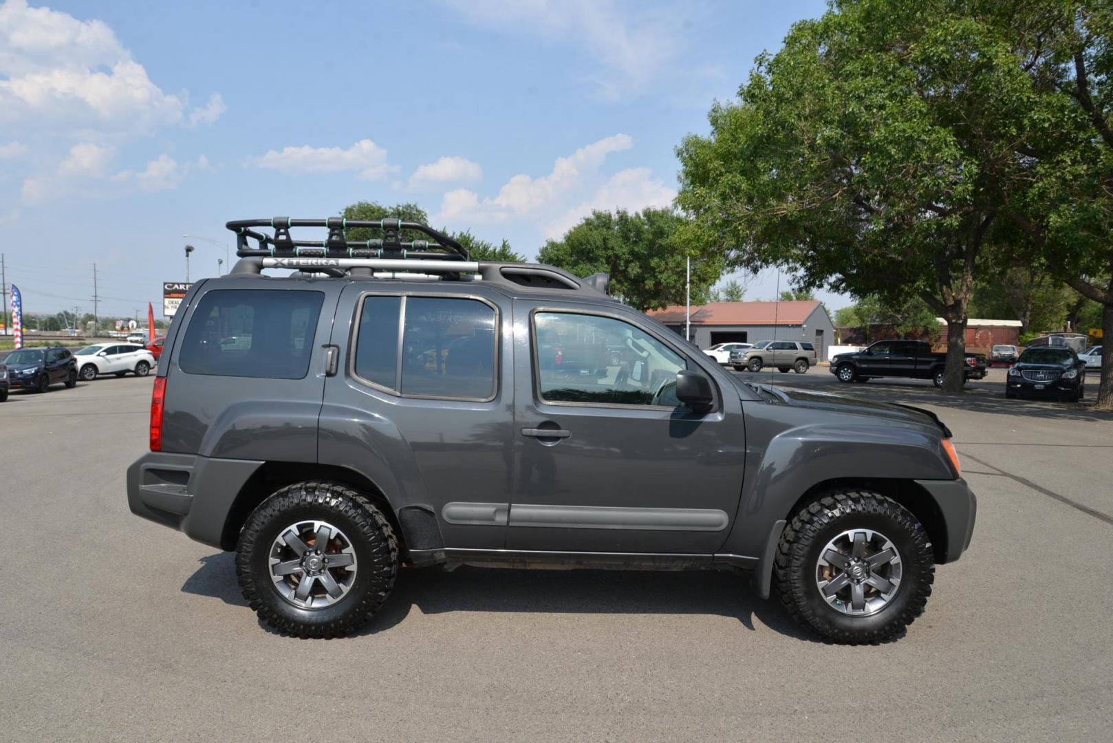 2014 gray /Grey Nissan Xterra Pro-4X (5N1AN0NW8EN) with an 4.0L V6 DOHC 24V engine, 5-Speed Automatic transmission, located at 4562 State Avenue, Billings, MT, 59101, (406) 896-9833, 45.769516, -108.526772 - 2014 Nissan Xterra Pro 4X 4x4 This Nissan is a 2 Owner vehicle and was locally traded in. There are no accidents reported on the history report. It has only 105000 miles. The Tires are like new, and they are 16 inch MTX Mud Claw Tires. You can tell this SUV has been cared for as it is in very nice - Photo#1