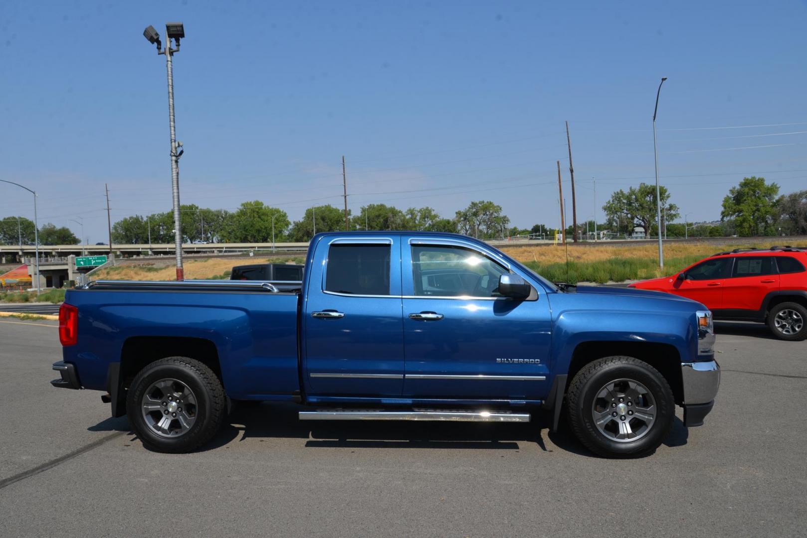 2016 Blue /Black Chevrolet Silverado 1500 LTZ Double Cab Short Box 4WD (1GCVKSEC0GZ) with an 5.3L V8 OHV 16V engine, 6 speed automatic transmission, located at 4562 State Avenue, Billings, MT, 59101, (406) 896-9833, 45.769516, -108.526772 - 2016 Chevy Silverado 1500 double Cab 4x4 LTZ This Chevy is very Clean, The history report shows its a 1 Owner Truck with no accidents reported. This Truck has low miles, It Runs and drives nicely and the tires are in next to new condition. it has a 5.3 Liter V8, 6 Speed automatic transmission, 3. - Photo#1