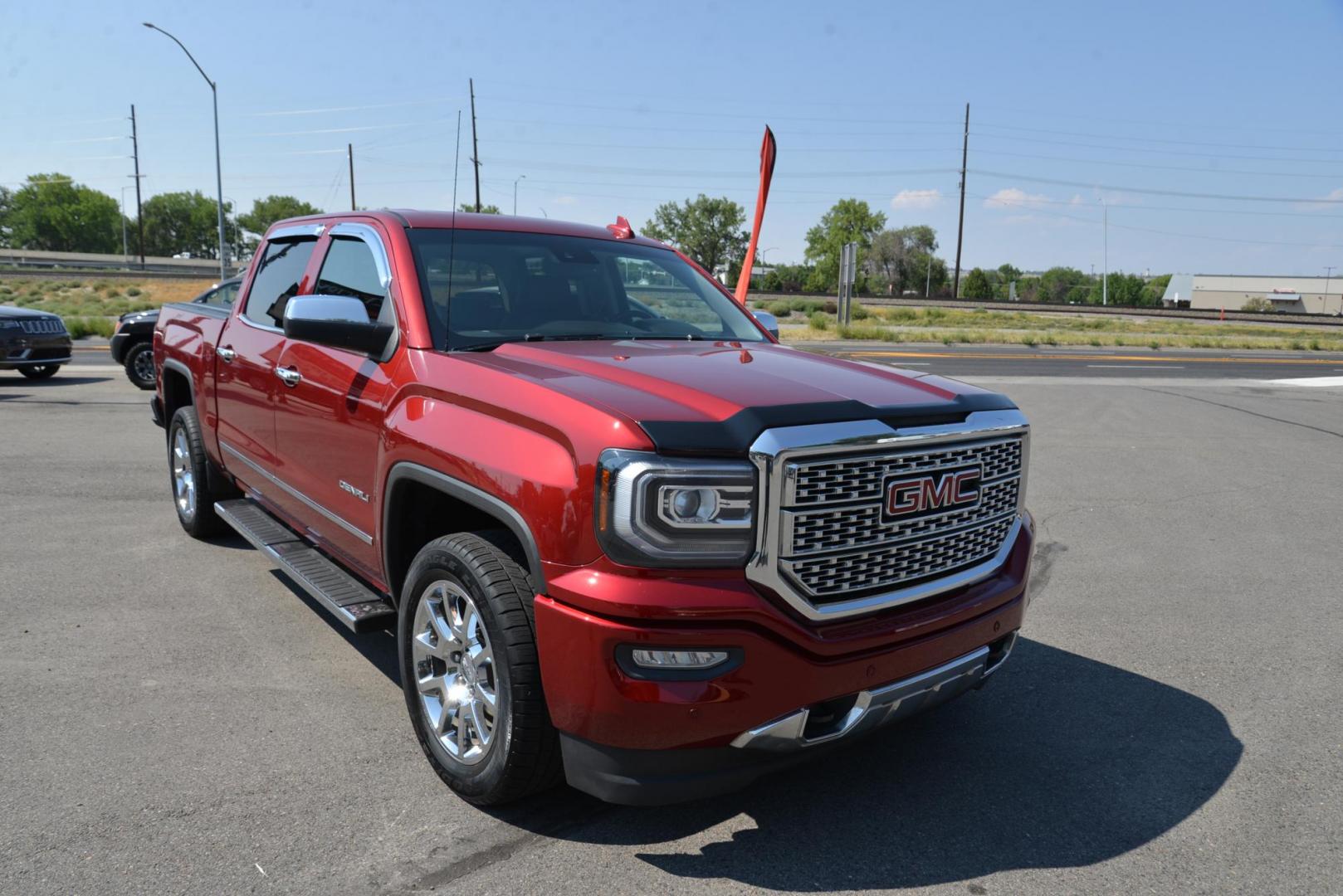 2018 Red Quartz Tintcoat /dark charcoal GMC Sierra 1500 Denali Crew Cab Long Box 4WD (3GTU2PEC3JG) with an 5.3L V8 OHV 16V engine, 8 speed Automatic transmission, located at 4562 State Avenue, Billings, MT, 59101, (406) 896-9833, 45.769516, -108.526772 - Photo#1