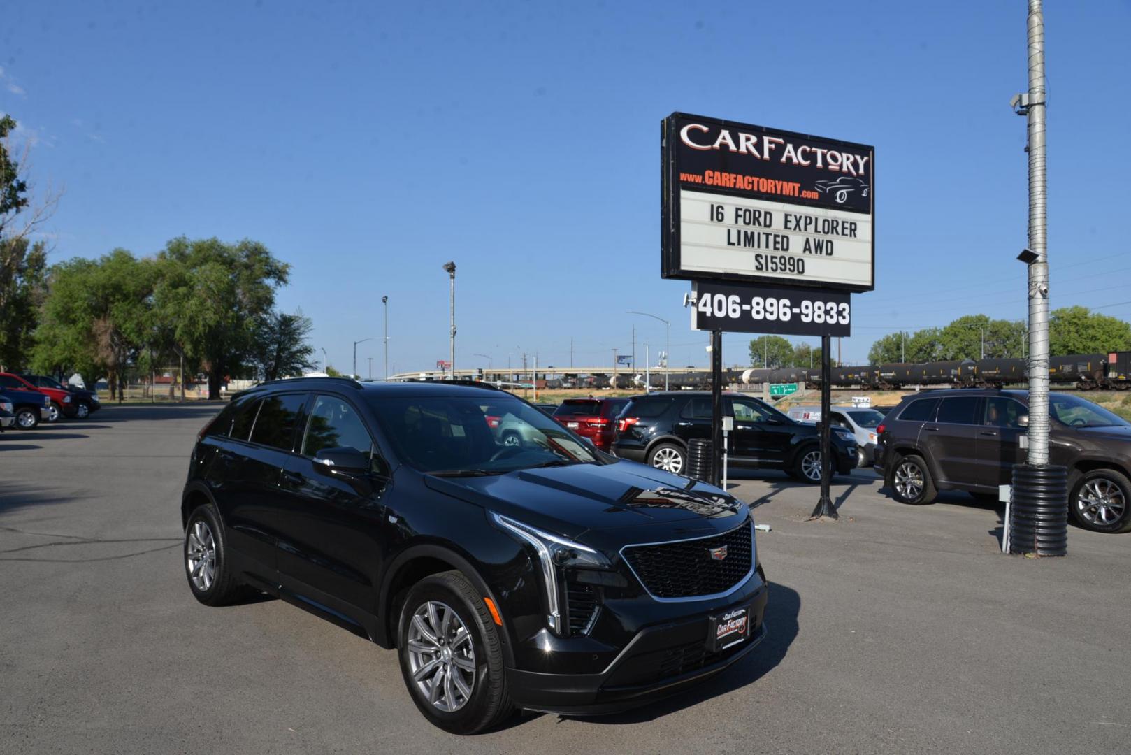 2022 Stellar Black Metallic /Jet Black Cadillac XT4 Sport AWD (1GYFZFR40NF) with an 2.0L L4 DOHC 16V engine, 9A transmission, located at 4562 State Avenue, Billings, MT, 59101, (406) 896-9833, 45.769516, -108.526772 - This Cadillac has remaining factory warranty, only 15,124 miles, and was a local trade-in. It is a two-owner SUV with no accidents reported on the history report. The Cadillac is in excellent condition. The tires are 18-inch Continental ProContact TX, and they are in good condition. Engine: 2.0L - Photo#2