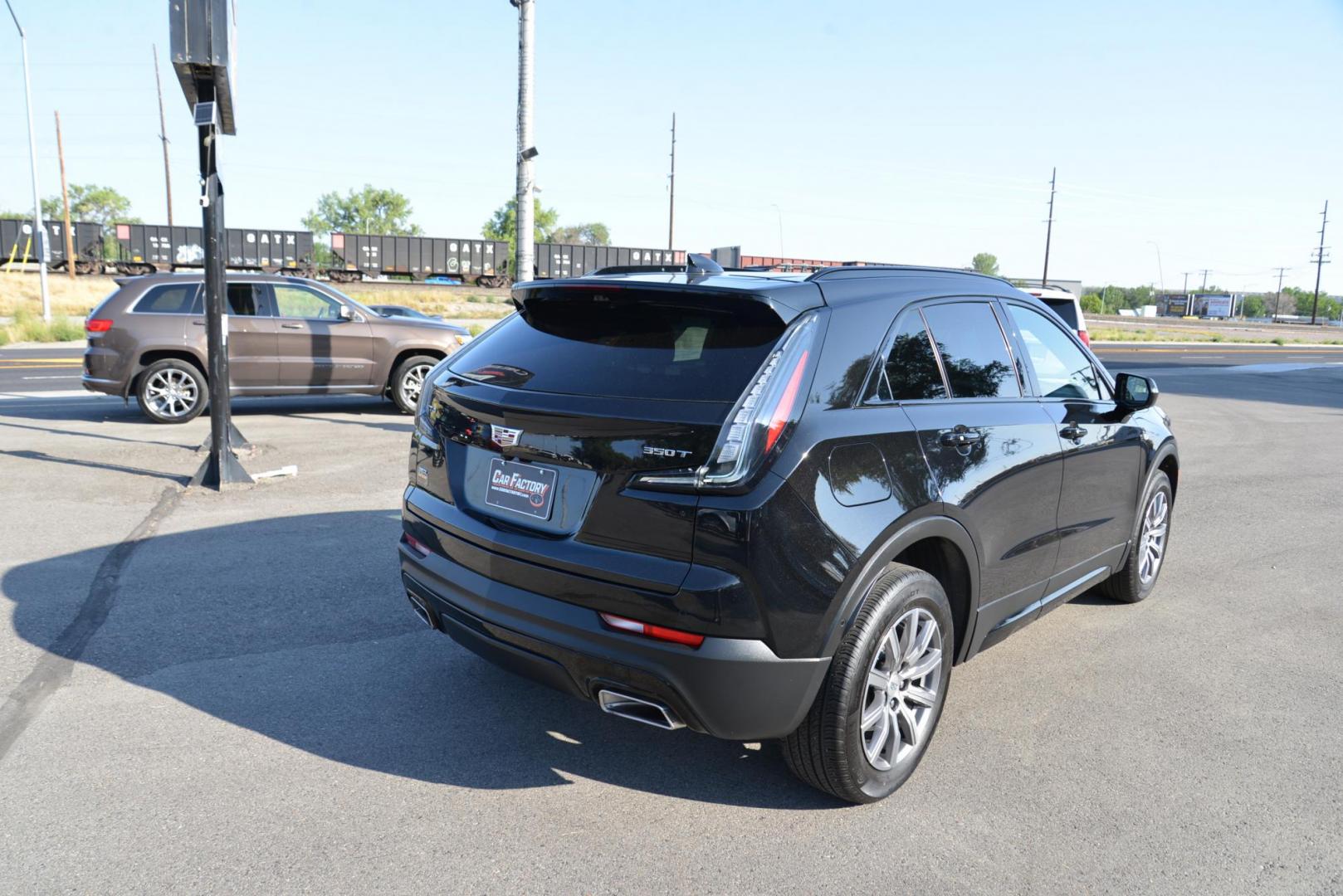 2022 Stellar Black Metallic /Jet Black Cadillac XT4 Sport AWD (1GYFZFR40NF) with an 2.0L L4 DOHC 16V engine, 9A transmission, located at 4562 State Avenue, Billings, MT, 59101, (406) 896-9833, 45.769516, -108.526772 - This Cadillac has remaining factory warranty, only 15,124 miles, and was a local trade-in. It is a two-owner SUV with no accidents reported on the history report. The Cadillac is in excellent condition. The tires are 18-inch Continental ProContact TX, and they are in good condition. Engine: 2.0L - Photo#3