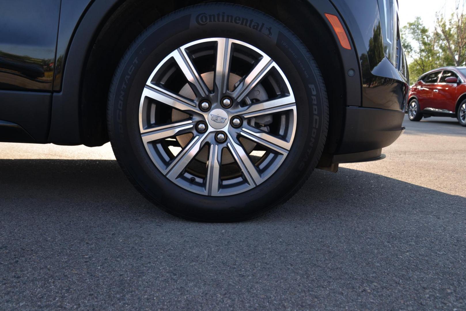 2022 Stellar Black Metallic /Jet Black Cadillac XT4 Sport AWD (1GYFZFR40NF) with an 2.0L L4 DOHC 16V engine, 9A transmission, located at 4562 State Avenue, Billings, MT, 59101, (406) 896-9833, 45.769516, -108.526772 - This Cadillac has remaining factory warranty, only 15,124 miles, and was a local trade-in. It is a two-owner SUV with no accidents reported on the history report. The Cadillac is in excellent condition. The tires are 18-inch Continental ProContact TX, and they are in good condition. Engine: 2.0L - Photo#22