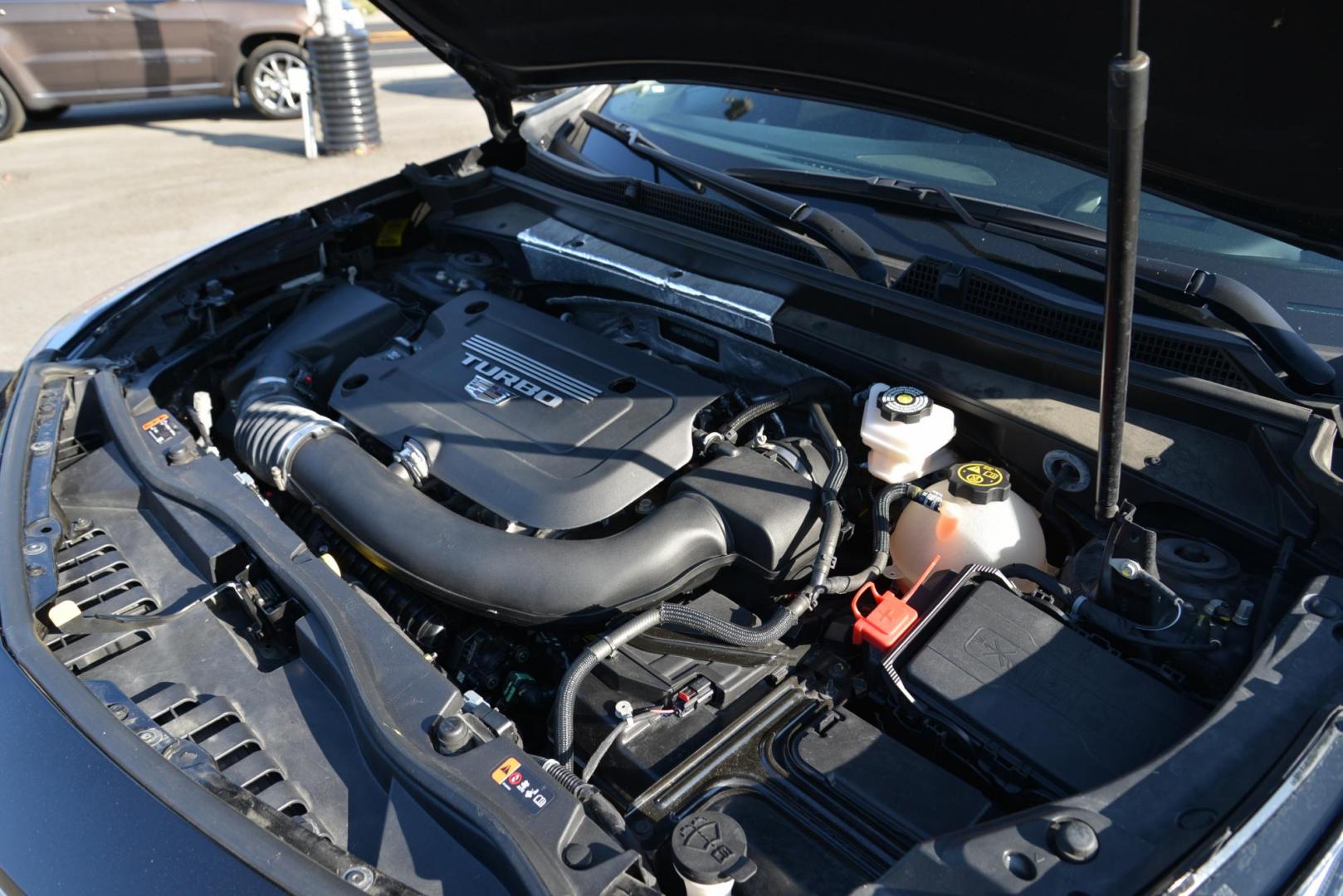 2022 Stellar Black Metallic /Jet Black Cadillac XT4 Sport AWD (1GYFZFR40NF) with an 2.0L L4 DOHC 16V engine, 9A transmission, located at 4562 State Avenue, Billings, MT, 59101, (406) 896-9833, 45.769516, -108.526772 - This Cadillac has remaining factory warranty, only 15,124 miles, and was a local trade-in. It is a two-owner SUV with no accidents reported on the history report. The Cadillac is in excellent condition. The tires are 18-inch Continental ProContact TX, and they are in good condition. Engine: 2.0L - Photo#25