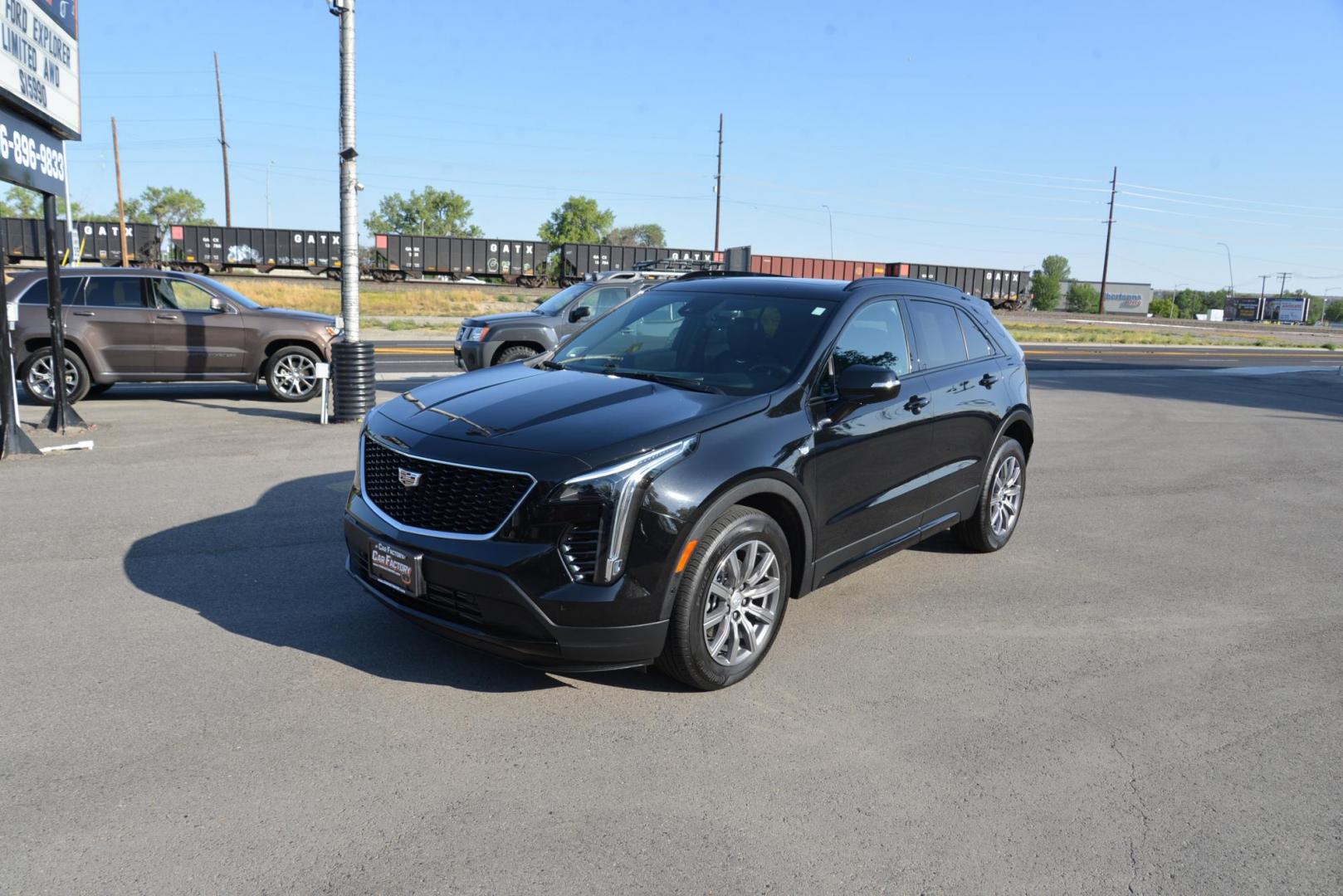 2022 Stellar Black Metallic /Jet Black Cadillac XT4 Sport AWD (1GYFZFR40NF) with an 2.0L L4 DOHC 16V engine, 9A transmission, located at 4562 State Avenue, Billings, MT, 59101, (406) 896-9833, 45.769516, -108.526772 - This Cadillac has remaining factory warranty, only 15,124 miles, and was a local trade-in. It is a two-owner SUV with no accidents reported on the history report. The Cadillac is in excellent condition. The tires are 18-inch Continental ProContact TX, and they are in good condition. Engine: 2.0L - Photo#5