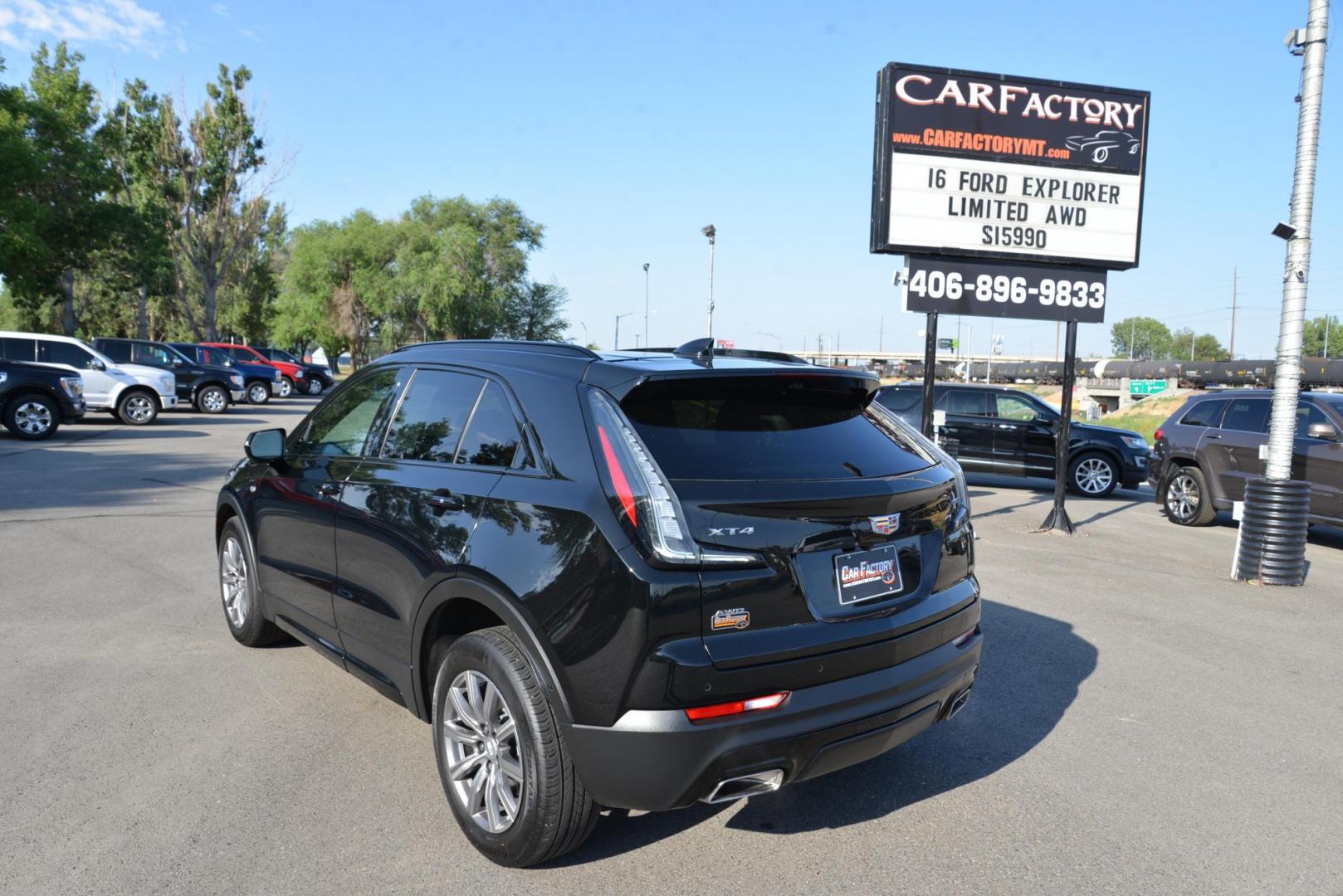 2022 Stellar Black Metallic /Jet Black Cadillac XT4 Sport AWD (1GYFZFR40NF) with an 2.0L L4 DOHC 16V engine, 9A transmission, located at 4562 State Avenue, Billings, MT, 59101, (406) 896-9833, 45.769516, -108.526772 - This Cadillac has remaining factory warranty, only 15,124 miles, and was a local trade-in. It is a two-owner SUV with no accidents reported on the history report. The Cadillac is in excellent condition. The tires are 18-inch Continental ProContact TX, and they are in good condition. Engine: 2.0L - Photo#6