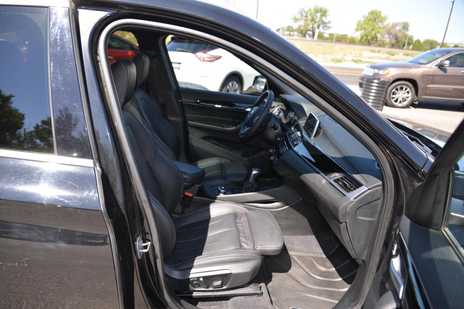 2018 black /Black BMW X1 sDrive28i (WBXHU7C33J5) with an 2.0L L4 DOHC 16V engine, 8A transmission, located at 4562 State Avenue, Billings, MT, 59101, (406) 896-9833, 45.769516, -108.526772 - This is a 2018 BMW X1 sDrive28i The X1 is a Low Mileage two owner vehicle, there are multiple service records reported and there are no accidents reported on the history report, The BMW has very low miles and runs and drives smooth and quiet. The tires are in great shape, this cross over is very cl - Photo#23