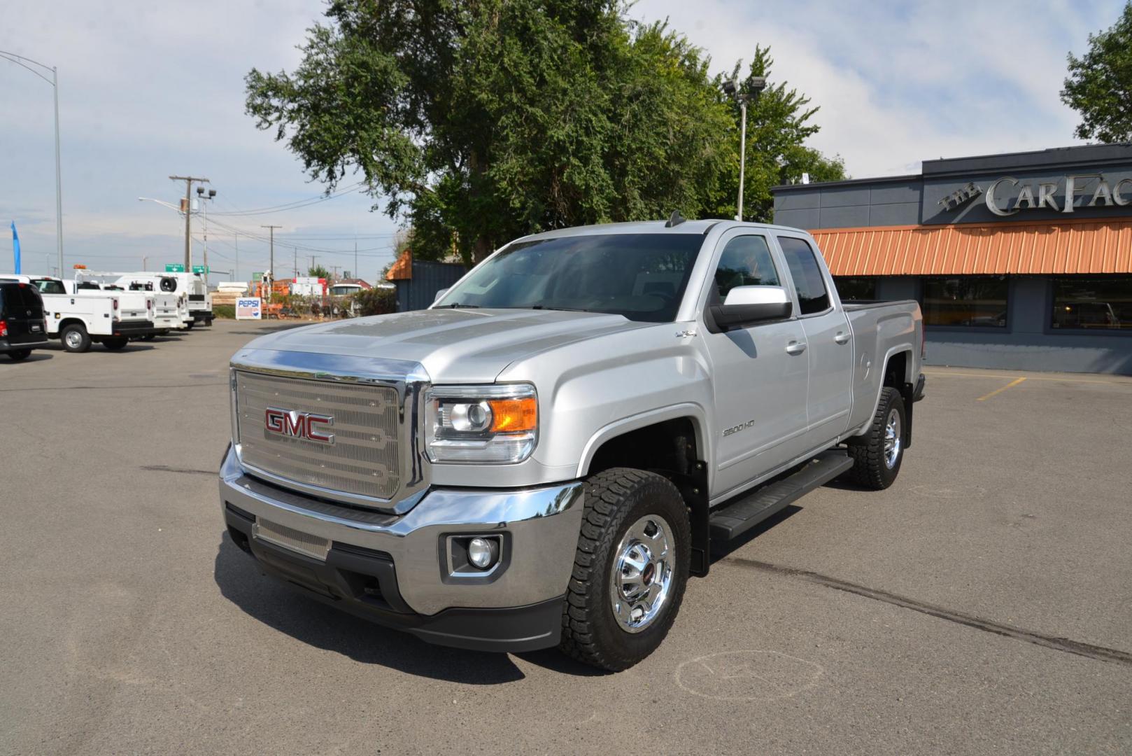 2015 Quicksilver Metallic /Dark Ash GMC Sierra 2500HD SLE Double Cab 4WD (1GT22YEG7FZ) with an 6.0L V8 OHV 16V FFV engine, 6-Speed Heavy Duty Automatic transmission, located at 4562 State Avenue, Billings, MT, 59101, (406) 896-9833, 45.769516, -108.526772 - 2015 GMC Sierra SLE Double Cab 4x4 This Low Mileage GMC is a One Owner truck with no accidents reported on the history report. the Interior and Exterior are in very clean shape given its year. The Sierra runs and drives nicely. The Tires are 17 Inch Nitto Grappler's and they are in great condition - Photo#2