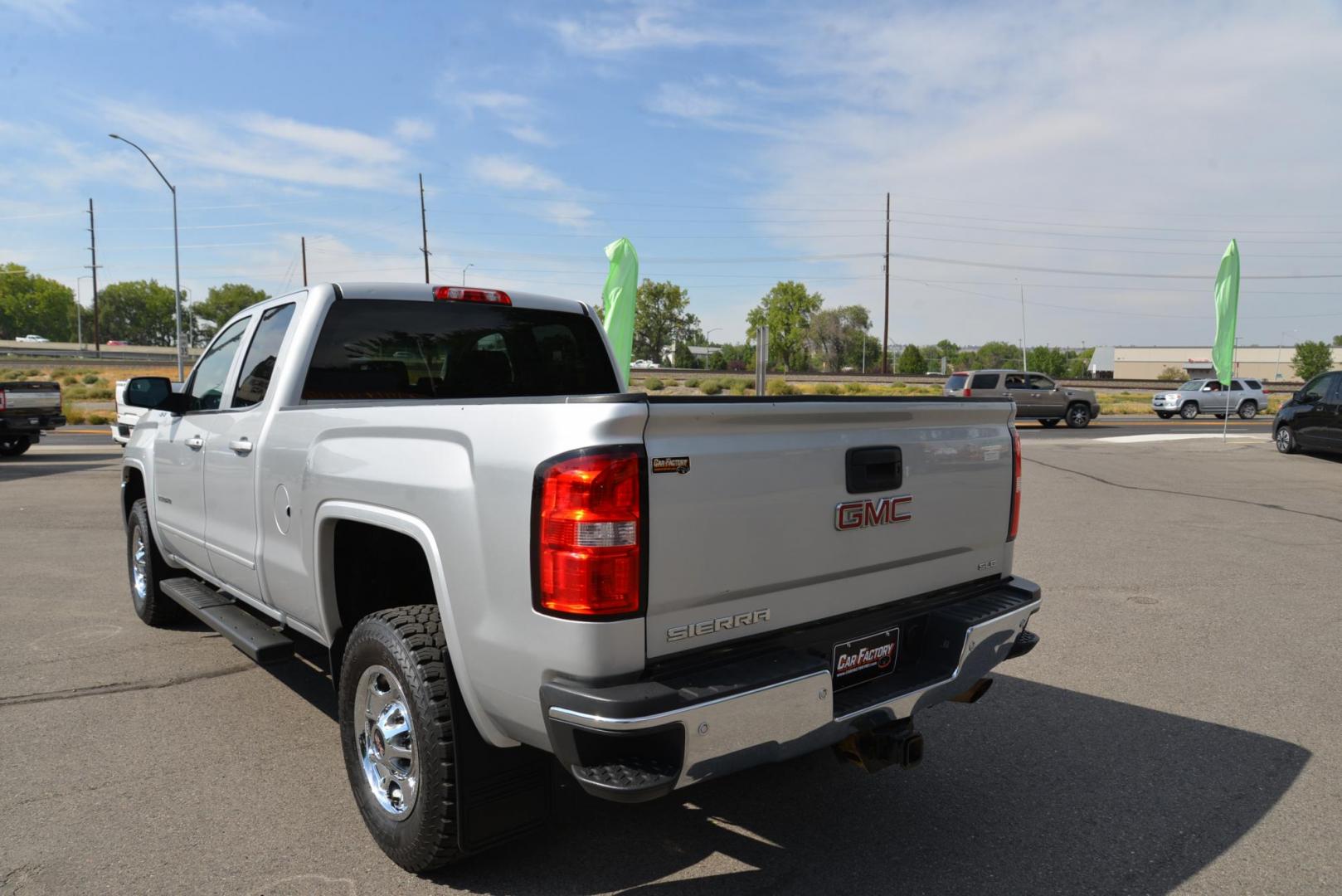 2015 Quicksilver Metallic /Dark Ash GMC Sierra 2500HD SLE Double Cab 4WD (1GT22YEG7FZ) with an 6.0L V8 OHV 16V FFV engine, 6-Speed Heavy Duty Automatic transmission, located at 4562 State Avenue, Billings, MT, 59101, (406) 896-9833, 45.769516, -108.526772 - 2015 GMC Sierra SLE Double Cab 4x4 This Low Mileage GMC is a One Owner truck with no accidents reported on the history report. the Interior and Exterior are in very clean shape given its year. The Sierra runs and drives nicely. The Tires are 17 Inch Nitto Grappler's and they are in great condition - Photo#3