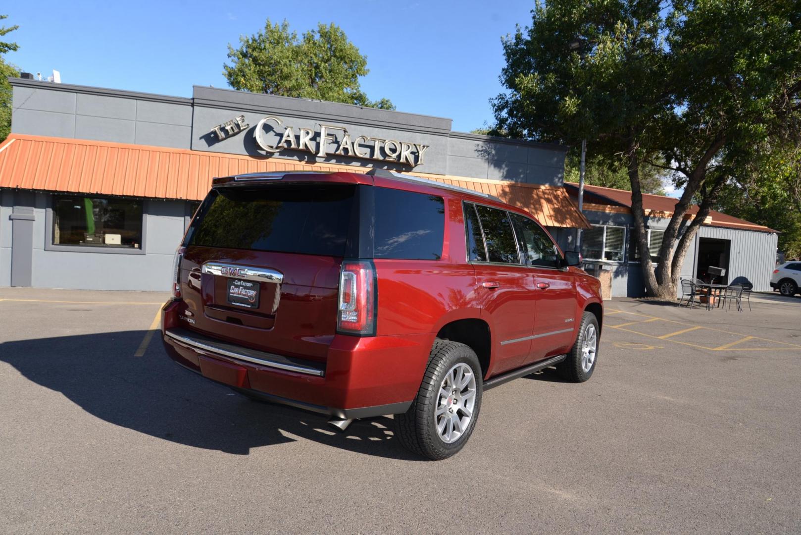 2017 Crimson Red Tintcoat /Cocoa/Dark Atmosphere GMC Yukon Denali Denali (1GKS2CKJ6HR) with an 6.2L V8 OHV 16V engine, 8 speed Automatic transmission, located at 4562 State Avenue, Billings, MT, 59101, (406) 896-9833, 45.769516, -108.526772 - 2017 GMC Yukon Denali 4x4 with 3rd row seating The Yukon is a low mileage Trade In , there are no accidents recorded on the vehicle history report, It operates and handles smoothly. The Interior and Exterior are both very clean. The Tires are 20 inch Falkin Wild Peak's and they are in great shape - Photo#4