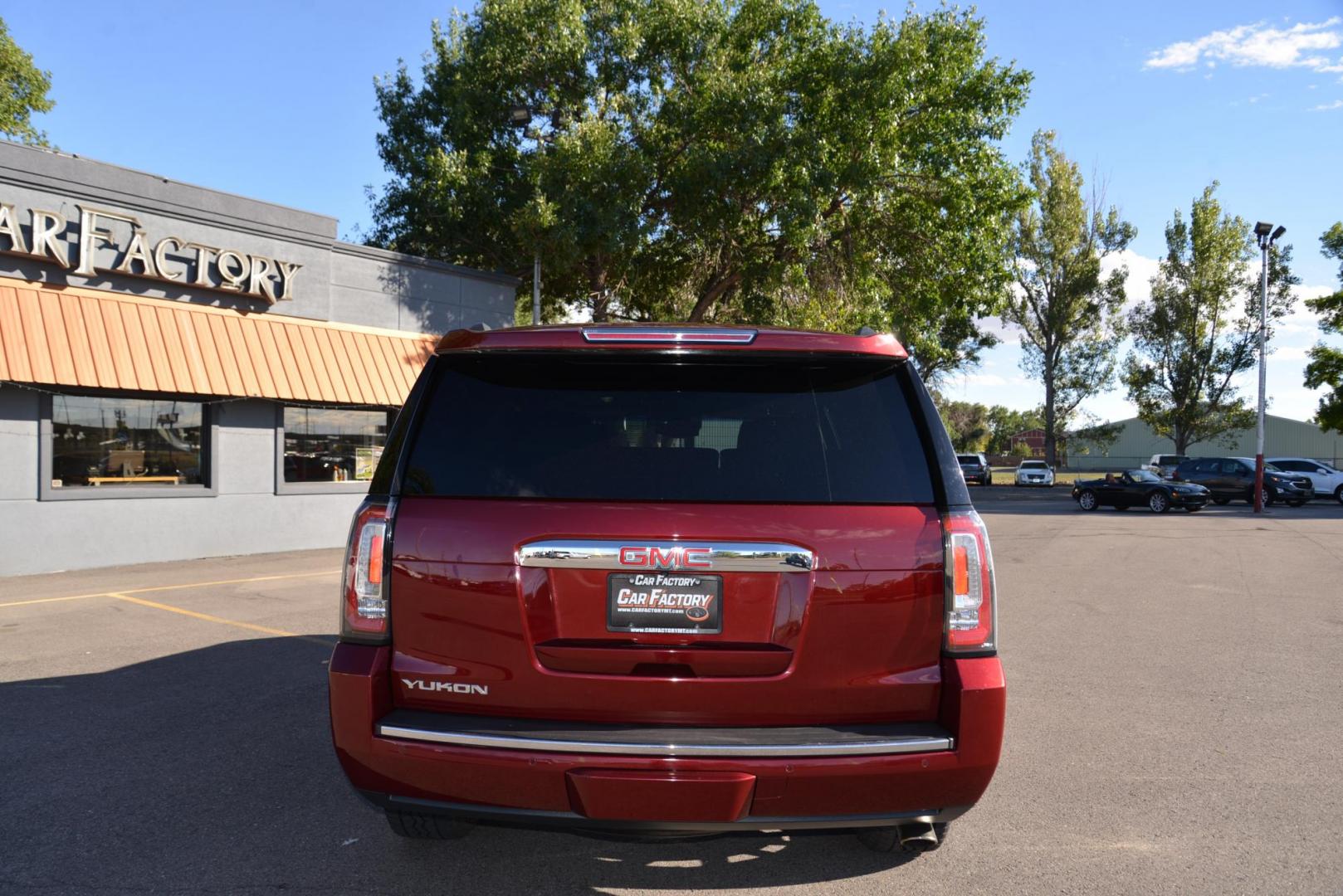 2017 Crimson Red Tintcoat /Cocoa/Dark Atmosphere GMC Yukon Denali Denali (1GKS2CKJ6HR) with an 6.2L V8 OHV 16V engine, 8 speed Automatic transmission, located at 4562 State Avenue, Billings, MT, 59101, (406) 896-9833, 45.769516, -108.526772 - 2017 GMC Yukon Denali 4x4 with 3rd row seating The Yukon is a low mileage Trade In , there are no accidents recorded on the vehicle history report, It operates and handles smoothly. The Interior and Exterior are both very clean. The Tires are 20 inch Falkin Wild Peak's and they are in great shape - Photo#5