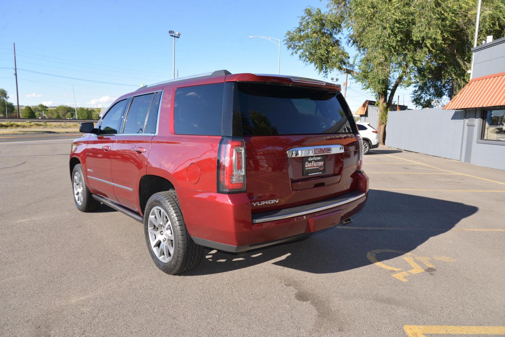 2017 Crimson Red Tintcoat /Cocoa/Dark Atmosphere GMC Yukon Denali Denali (1GKS2CKJ6HR) with an 6.2L V8 OHV 16V engine, 8 speed Automatic transmission, located at 4562 State Avenue, Billings, MT, 59101, (406) 896-9833, 45.769516, -108.526772 - 2017 GMC Yukon Denali 4x4 with 3rd row seating The Yukon is a low mileage Trade In , there are no accidents recorded on the vehicle history report, It operates and handles smoothly. The Interior and Exterior are both very clean. The Tires are 20 inch Falkin Wild Peak's and they are in great shape - Photo#8