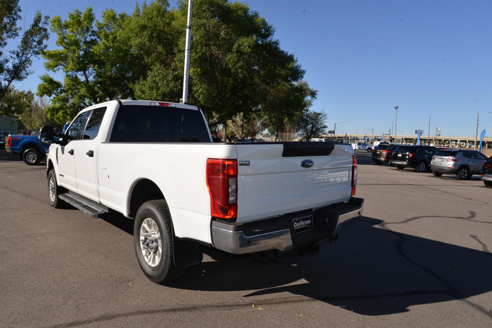 2021 Oxford White /Grey Ford F-350 SD XLT (1FT8W3BT4ME) with an 6.7L V8 OHV 16V DIESEL engine, 10 Speed Automatic transmission, located at 4562 State Avenue, Billings, MT, 59101, (406) 896-9833, 45.769516, -108.526772 - 2021 Ford F3 50 Super Duty Power Stroke Crew Cab 4x4 with an 8 foot bed it is a One Owner Diesel, there are no accidents recorded on the history report. The interior and exterior are very clean and the Ford runs and drives nicely. The tires are 18 inch Michelin LTX's and they are in next to new - Photo#4